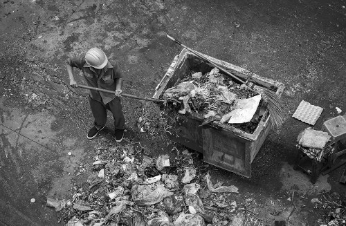 Workers handling rubbish removal in Hillsdale